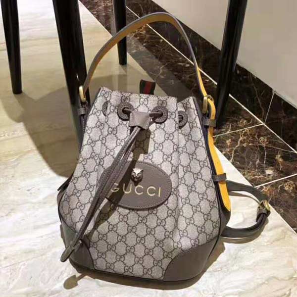 古奇橢圓形經(jīng)典皮料桶形抽繩背包473875