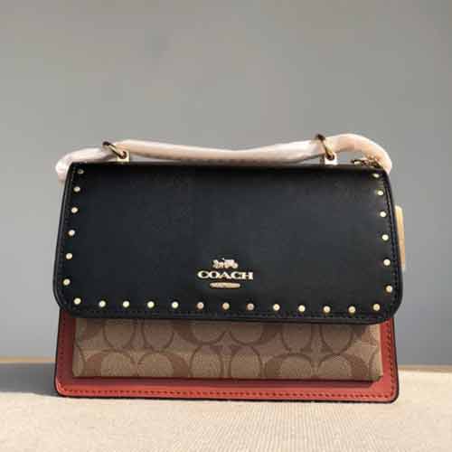 蔻馳奧萊款哈頓系列鉚釘拼色女包，時尚百搭多用途！